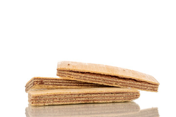 Three sweet chocolate wafers, close-up, isolated on white background.