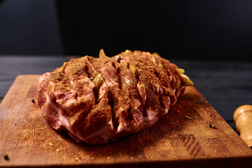 Meat in seasoning ready for baking in the oven. Cooking homemade meat