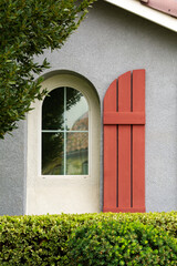 Arch window and decorative shutter of a house, Menifee, California