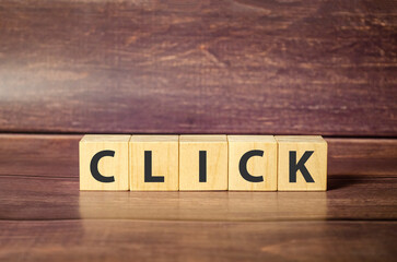 Click wooden block word on brown background