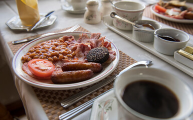 The Full Irish Breakfast served at a Bed and Breakfast table with coffee and scones; Cong, County Mayo, Ireland