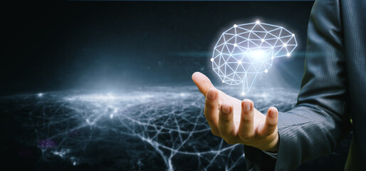 The hand shows a brain made of connections.