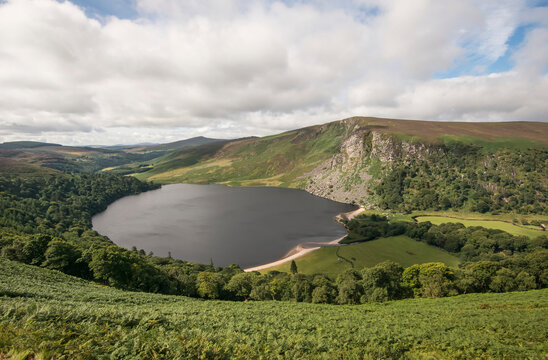 Overview of Guinness Lake (Lough Tay) in Sallys Gap, a scenic drive through the Wicklow Mountains; County Wicklow, Ireland