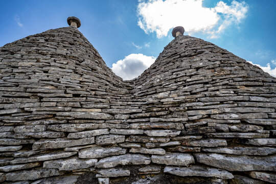 Close-up of the conical slate roofs of the traditional round stone Trulli houses of Alberobello; Alberobello, Puglia, Italy