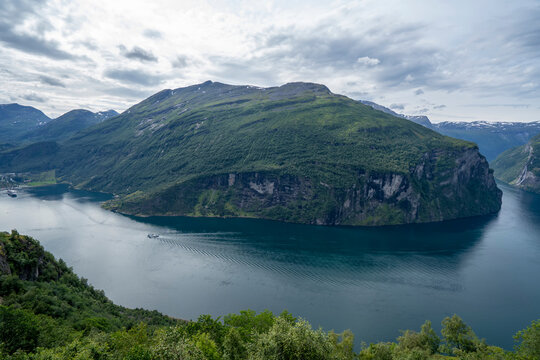 Scenic view of the mountainous landscape surrounding a bend in the Geirangerfjord in Sunnmore; Geirangerfjord, Stranda, Norway