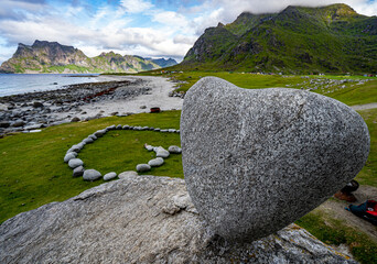 The dramatic coastal mountain and rock landscape of Uttakleiv Beach in Lofoten, Norway