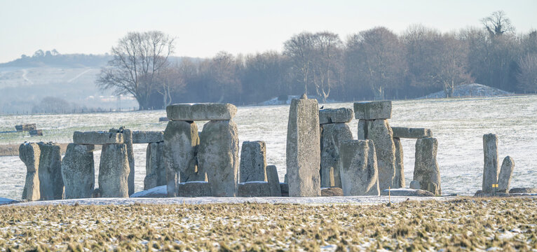 Stonehenge defined by early morning snow; Wiltshire, England