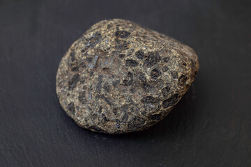 Mineral coal black rock isolated on black background