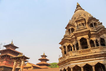 Chyasi Deval Krishna and Taleju hindu temples on Patan Durbar Square in a sunny day in Lalitpur city, Nepal. Religious architecture. Copy space for your text. Travel in asia theme.