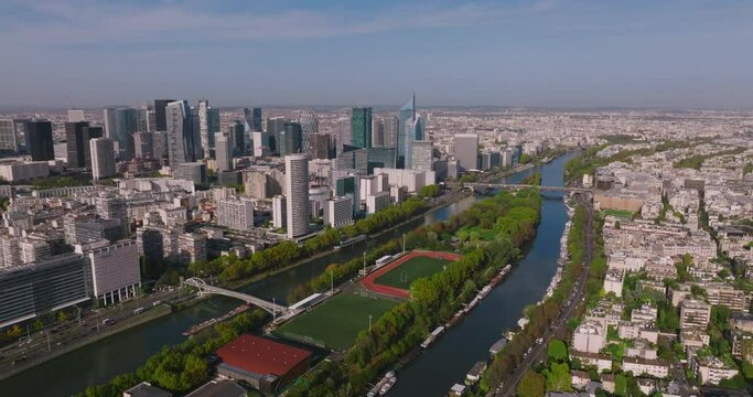 The Parisian skyscrapers in the heart of the business district near the River Seine in France are filmed from a drone. Flying a drone near a popular business center. Manhattan in the center of Europe