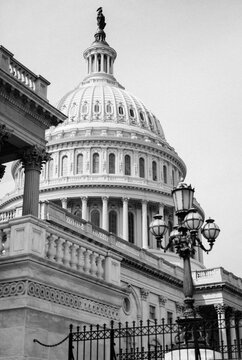 Black and white image of the United States Capitol Building in Washington, District of Columbia.