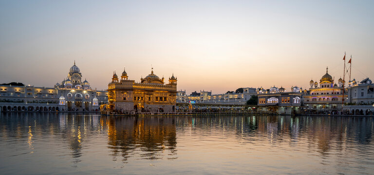 The Golden Temple (Sri Harmandir Sahib) Gurdwara and Sarovar (Pool of Nectar), at dusk; Amritsar, Punjab, India