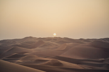 Fototapeta na wymiar Sunset at Rub Al Khali Moreeb Dunes in the U.A.E.