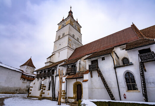 The fortified Gothic Saxon Church of Saint Nicolas of Harman (Honigberg) in winter, near Brasov, Transylvania, Romania; Brasov, Transylvania, Romania