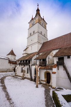 The fortified Gothic Saxon Church of Saint Nicolas of Harman (Honigberg) in winter, near Brasov, Transylvania, Romania; Brasov, Transylvania, Romania