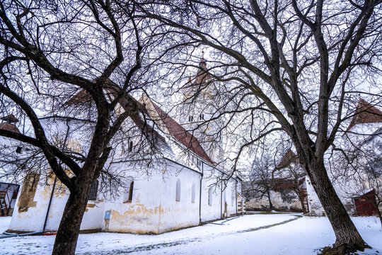 The fortified Gothic Saxon Church of Saint Nicolas of Harman (Honigberg) in winter, near Brasov, Transylvania, Romania; Brasov, Transylvania, Romania