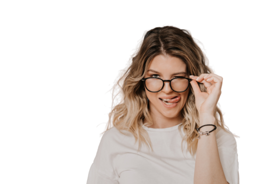Close up portrait of a cute Italian blonde in glasses wearing light blouse, shows her tongue and winks, over transparent background with copy space. Positive people concept. Mockup, seductive woman.