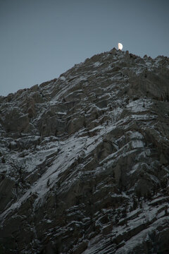 The moon rises above the first snow on Lone Pine peak.