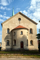 Fototapeta na wymiar The apse of the historic Roman Catholic church in the village of Pieski