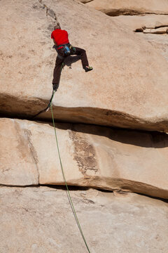 A trad climber ascends The Hobbit's Roof'.