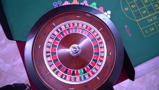 Roulette table, close-up in a casino - selective focus. Casino and gambling concept. Casino gamblers, roulette gambling, poker table.
