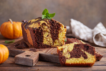 Pound marble cake with chocolate and pumpkin layers. Delicious homemade dessert. 