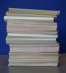  close up on stacking files and documents in a pile