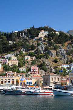 Boats moored in the marina at Gialos Harbor, Symi (Simi) Island; Dodecanese Island Group, Greece