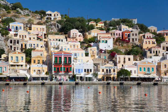 Seawall and buoys along the waterfront at the empty marina at Gialos Harbor, Symi (Simi) Island; Dodecanese Island Group, Greece