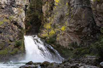 waterfall between old rocks beautiful nature background
