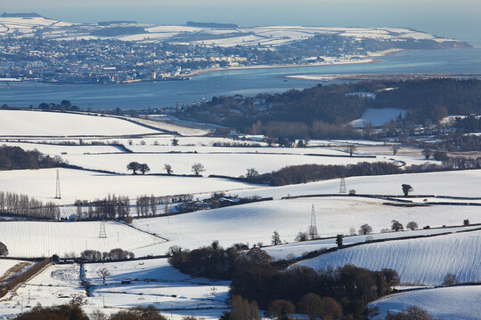 A winter view across the estuary of the River Exe to Exmouth, from the Mamhead Viewpoint in the Haldon Hills, near Exeter, Devon, Great Britain; Devon, England
