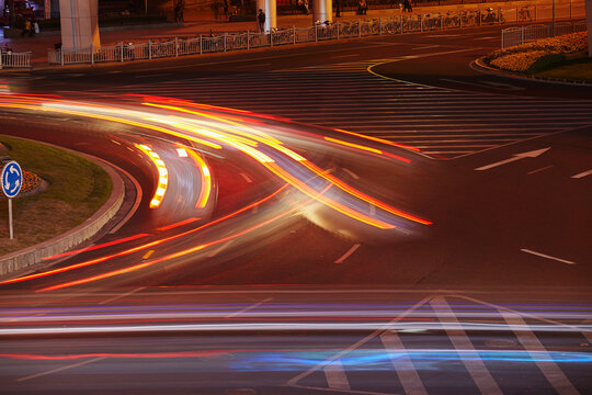Evening traffic on a roundabout in the Luzjiazui district of Pudong, Shanghai, China.; Lujiazui, Pudong, Shanghai, China.