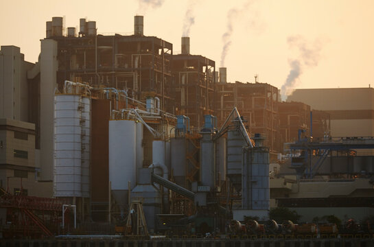 A coal-fired power station at sunset, Lamma Island, Hong Kong.; Yung Shue Wan, Lamma Island, Hong Kong, China.