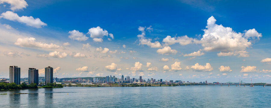 Montreal cityscape and St. Lawrence River viewed from Samuel De Champlain Bridge; Montreal, Quebec, Canada
