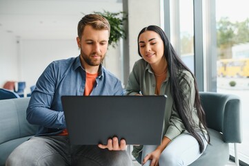 Business partners meeting in office lobby