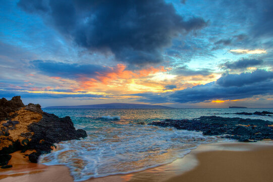 Beautiful sunset at twilight at Maui Wai or Secret Beach; Makena, Maui, Hawaii, United States of America