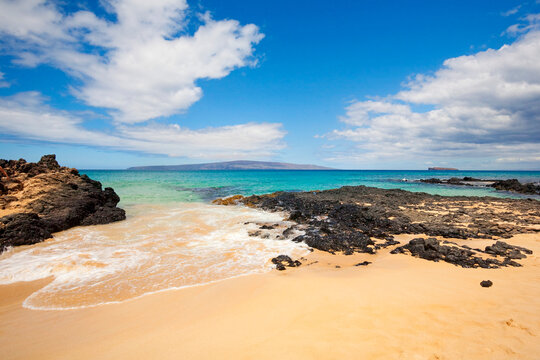 Secret Beach, also known as Secret Cove, Makena Cove, Wedding Beach and Paako Beach with Kahoolawe and Molokini in the distance; Makena, Maui, Hawaii, United States of America