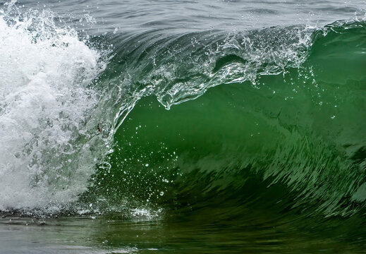 Close-up detail of an approaching wave breaking at the shore; South Shields, Tyne and Wear, England