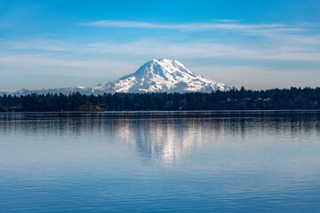 A reflective view of Mount Rainer from Dana Passage, South Puget Sound in Washington, approximately 60 miles distant; Washington, United States of America