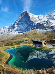 Snowy mountain reflection on the blue lake in M&auml;nnlichen, Switzerland