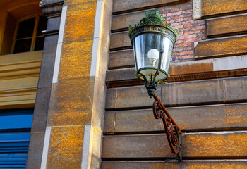 Street lamp in baroque style . Street light at the wall