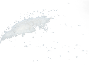 Salt flying explosion, crystal white grain salts explode abstract cloud fly. Beautiful complete seed salt splash in air, food object design. Selective focus freeze shot black background isolated