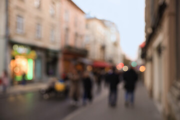Blurred view of people walking on city street