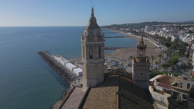 alt flying clockwise around castle tower in Sitges Spain