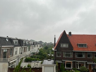 Picturesque view of city street with beautiful buildings on rainy day