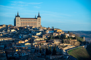 Views of the city of Toledo and its Alcazar, civil and military fortification, during sunrise on a clear and sunny day
