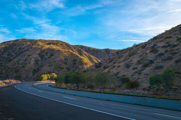 Salton Sea area landscape series,  Curved road to the mountains in Palm Springs, Southern California, USA