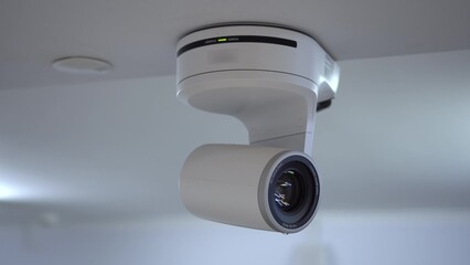 The remote controlled motorized camera is moving. Ceiling-mounted camera for live broadcasting and video recording.