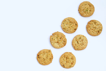 Pistachio and almond cookies on white background.