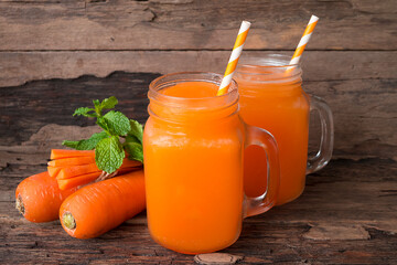 Carrot juice fruit smoothies yogurt drink orange healthy delicious taste in a glass slush for weight loss on wooden background.
